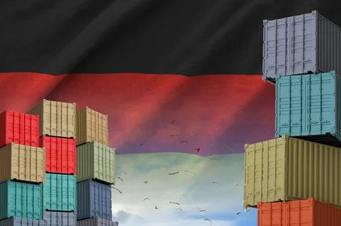 Germany flag and big stack of shipping cargo containers in docks with sky イラスト素材