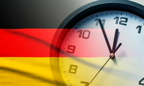 Germany flag with dial of a clock Stock Photos