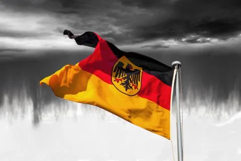 Germany flag on dramatic sky Stock Photos