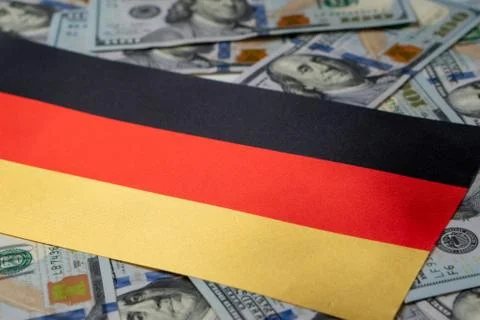 Germany Flag with US dollars as background. Concept for investors, soft focus Stock Photos