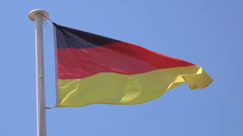 Germany German flag waving in the wind on a flagpole Stock Footage 244853509