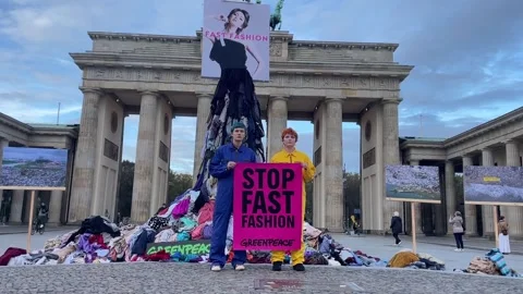 Germany: Greenpeace activists protest fast fashion waste in Berlin Stock Footage 320655842