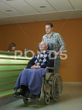 Germany, Hamburg, Man Pushing Senior Man In Wheel Chair