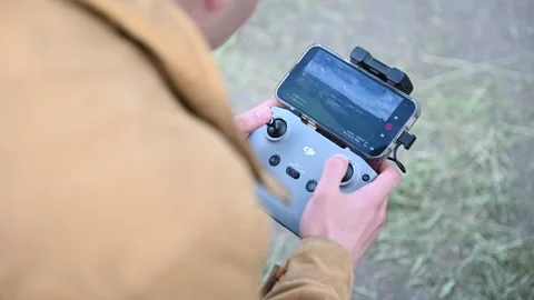 Germany-June 9,2026: Drone control in hand Vídeos de archivo 336637607