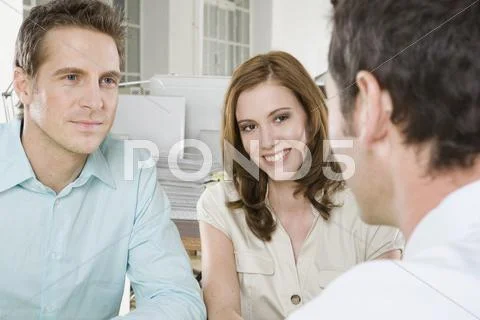 Germany, Munich, three Business people in office discussing, portrait Stock-Fotos