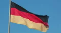 Germany national flag waving on flagpole on blue sky background HD Footage