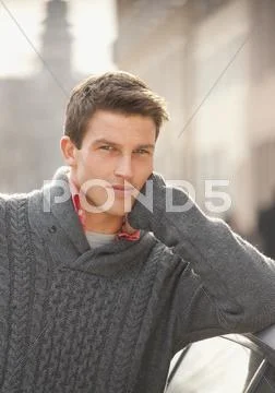 Germany, Portrait Of Young Man In Sweater