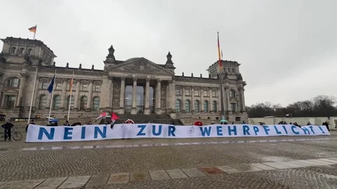 Germany: Protest held in front of German parliament against draft militar... Stock Footage 322777192