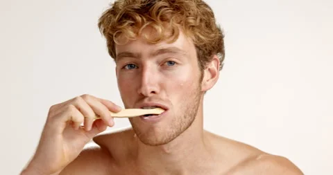 Germs, face or man brushing teeth in studio on white background for eco friendly Stock Footage 312407042