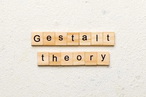 Gestalt theory word written on wood block. gestalt theory text on cement tabl Stock Photos