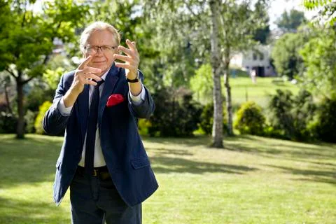 Gesticulate man in the garden Stock Photos