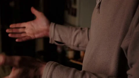 Gesticulation of the hands of a man during a conversation. An unrecognizabl.. Stock Footage 233469630