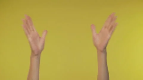 Gesture of aggression and anger on an isolated yellow background. 4K Video stock 122620180