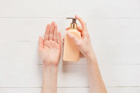 Gesture of womans hand using hand sanitizer Stock Photos