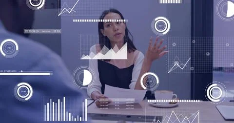 Gesturing executive presenting data at conference table, with printed documents Stock Photos