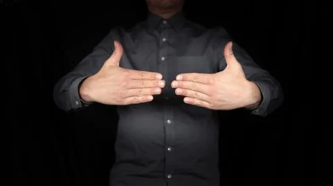 Gesturing hands, man delimiting himself, setting limits, signs, black background Stock Photos