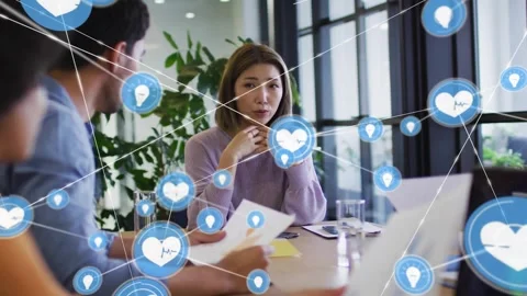 Gesturing lead purple sweater table blue icon appearing at hands visualizing Stock Footage 332285232