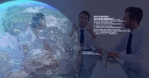Gesturing professionals analyzing code over laptops in boardroom, with globe Stock Photos