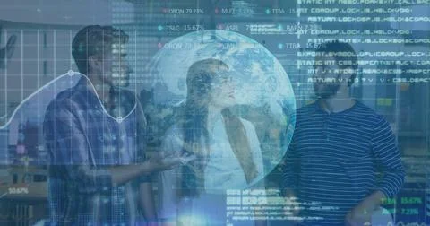 Gesturing tech team examining financial overlays in modern office, holographic Stock Photos
