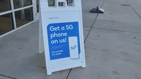 Get a 5G Phone on Us Xfinity Mobile Signage Street Stock Footage 219814546