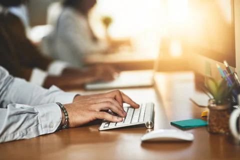 Get the clicking when a customer is need. an unrecognizable man typing on a Stock Photos