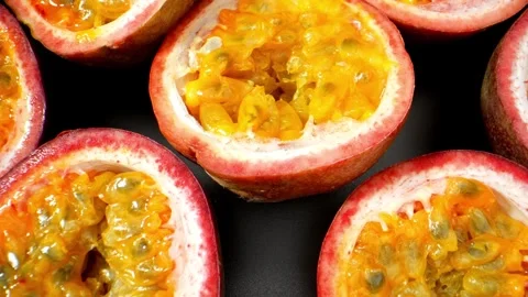 Get up close and personal with half-cut passion fruits in this  macro video.  Video stock 246592562