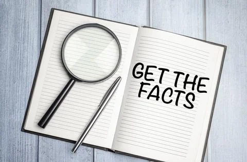 Get the facts word concept on notepad and magnifier Stock Photos