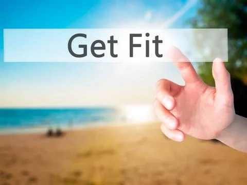 Get Fit - Hand pressing a button on blurred background concept on visual scre Stock Photos