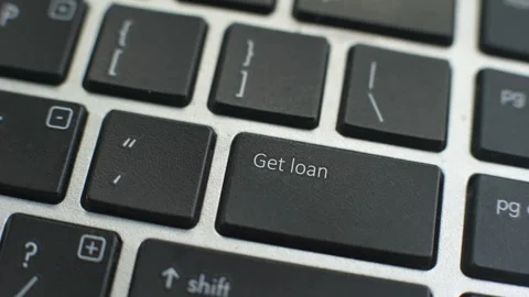 Get Loan button on computer keyboard, female hand fingers press key Stock Footage 97827500