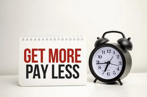Get more pay less words with calculator and clock with notebook Stock Photos