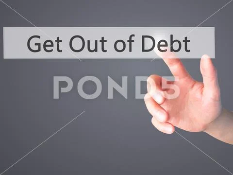 Get Out of Debt - Hand pressing a button on blurred background c Stock Photos