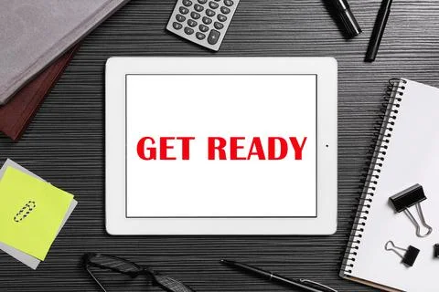 Get ready concept. Flat lay composition with tablet and stationery on black w 스톡 사진