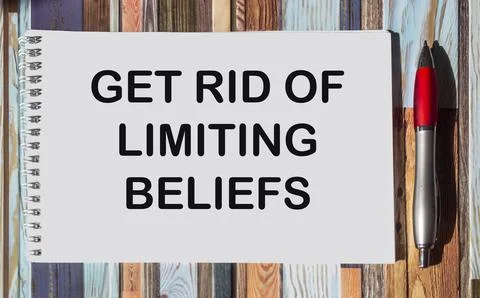 Get Rid Of Limiting Beliefs text quote on notepad, concept background Stock Photos