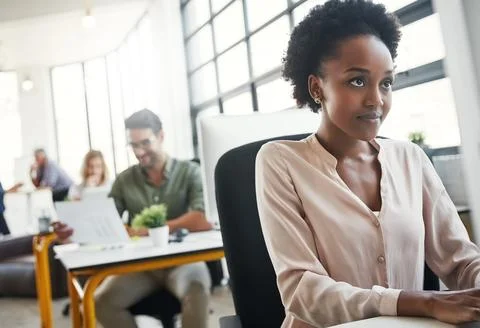 Get things done with the right resources. a designer working on her computer at Stock Photos