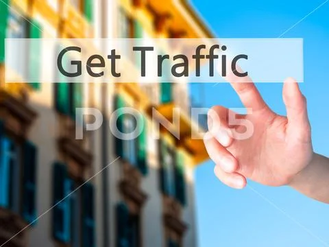 Get Traffic - Hand pressing a button on blurred background conce Stock Photos