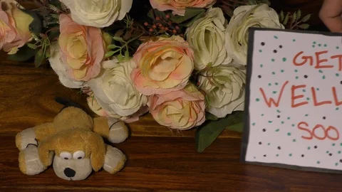 Get well soon card with dots and flowers with soft toy dog on the floor. Video stock 127017382