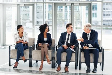 Getting a brief introduction while waiting Stock Photos