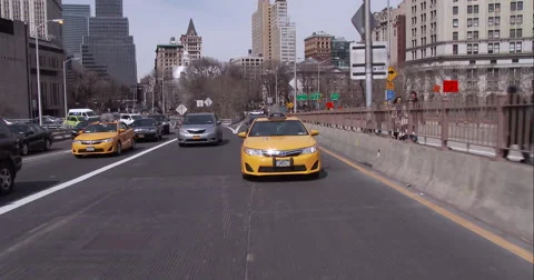 Getting onto the Brooklyn Bridge in downtown Manhattan Stock Footage 51239016
