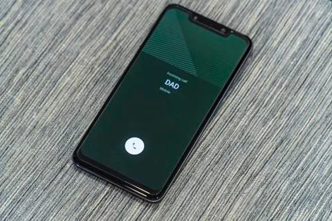 Getting a call from dad concept Stock Photos
