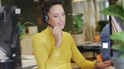 Getting call, support agent tuning mic, typing notes while pulling data as Stock Footage 333287733