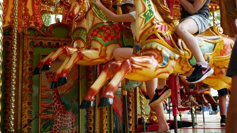 Getting off from the carousel at the Amusement Park in UK Stock Footage 111360387