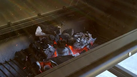 Getting the Charcol ready for the Summer BBQ. Meats will be cooking in No Stock Footage 108463698