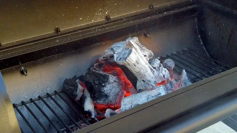 Getting the Charcol ready for the Summer BBQ. Meats will be cooking in No Stock Footage 108463706