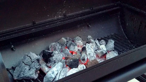 Getting the Charcol ready for the Summer BBQ. Meats will be cooking in No Stock Footage 108463709