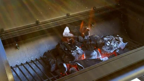 Getting the Charcol ready for the Summer BBQ. Meats will be cooking in No Stock Footage 108463808