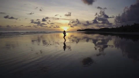 Getting closer to a dancing girl at the beach Stock Footage 151703607