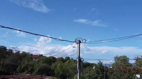 Getting closer to the top of the electricity pole with a drone Stock Footage 214428265