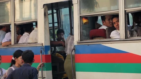 Getting on crowded bus, Myanmar city Stock Footage 102642923