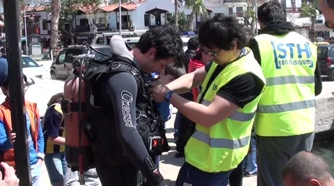 Getting a diver dressed Stock Footage 48860873