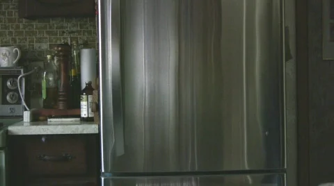 Getting a drink out of the fridge Stock Footage 575469